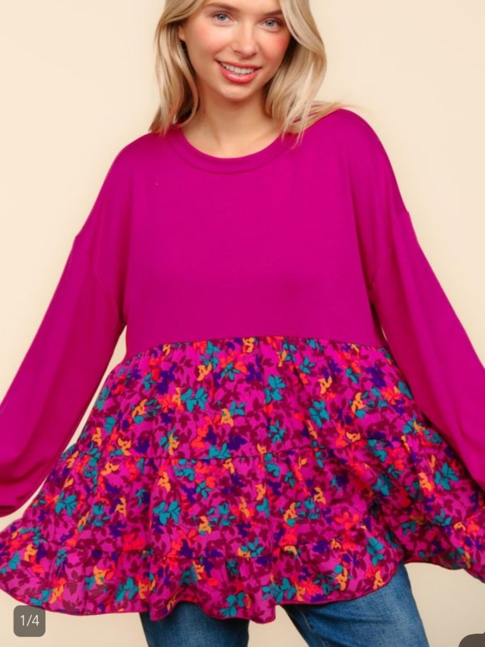 "A black blouse with a white floral print for a fresh, feminine look. Features a